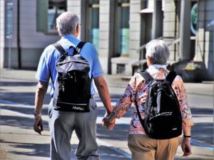 senior people with lightweight backpacks