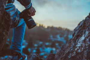 a person holding a professional camera